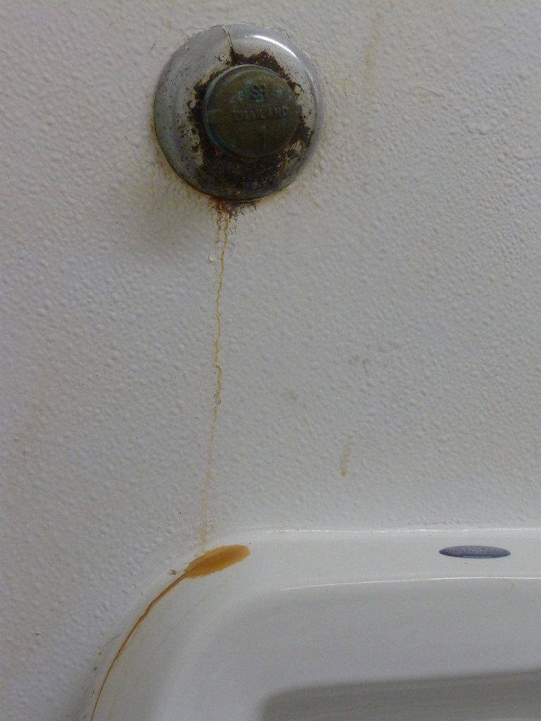 Leaking urinal plug (pipe?) in the men's bathroom Chester Paul Sgroi