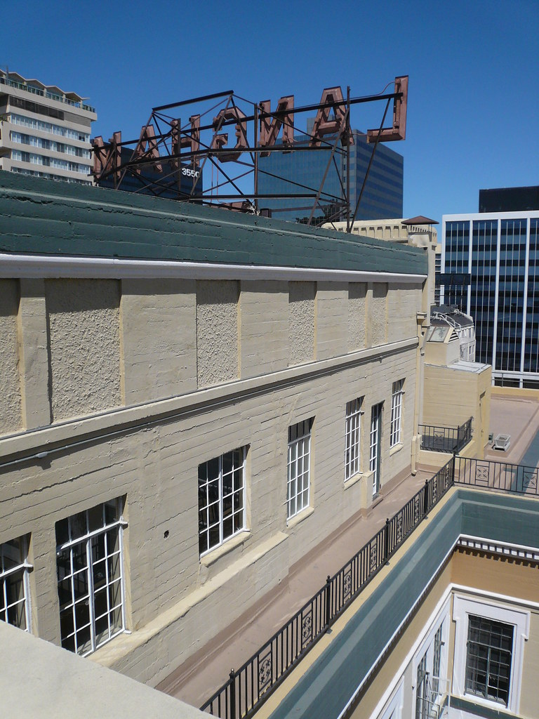 Langham Apartments The building's neon rooftop sign is lit… Flickr