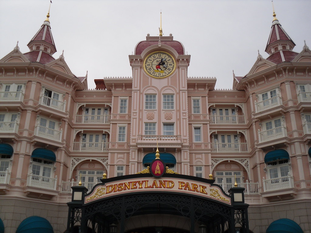 the entrance to disneyland park with the best hotel in the… Flickr