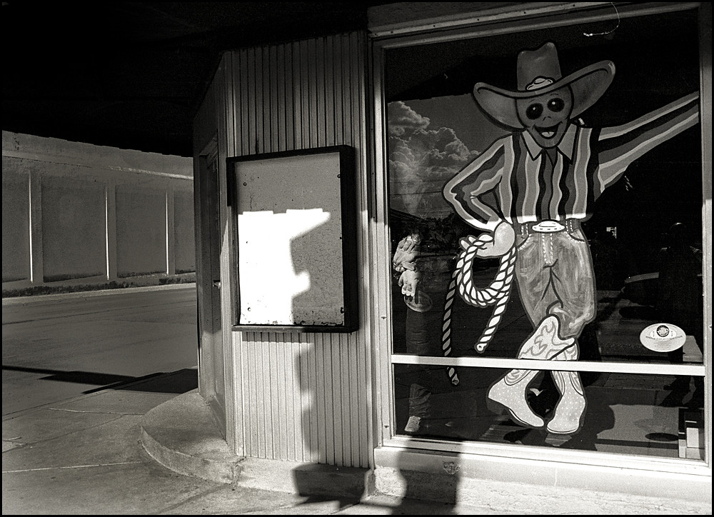 Storefront alien cowboy, Roswell, NM, 2002 Roswell has to