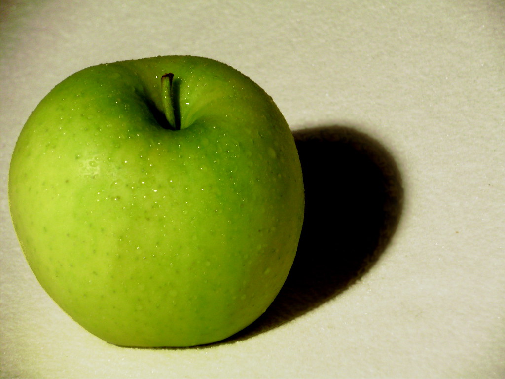 Green Apple A photo of a green apple resting on a white cl… Flickr