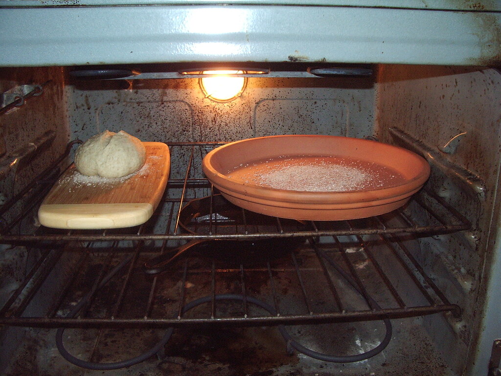 Oven set up For better baking, use a terracotta flower pot… Flickr