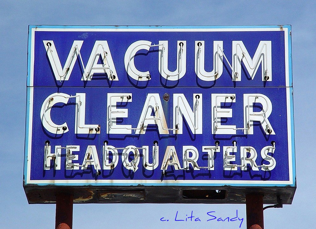 Vacuum Cleaner Headquarters Vintage Neon Sign (NonWorking) In Sunlight