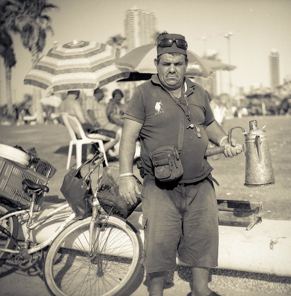 black coffee maker preparing black strong coffee on charco… Flickr