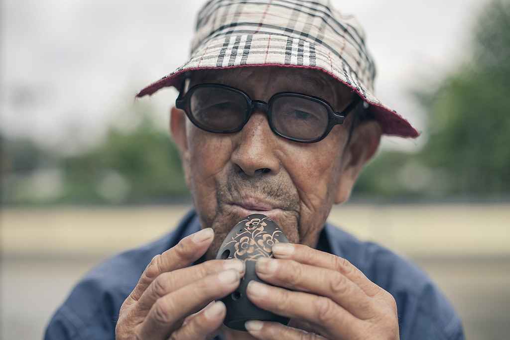 Ocarina A man playing a ocarina in Xian, China. Israel González