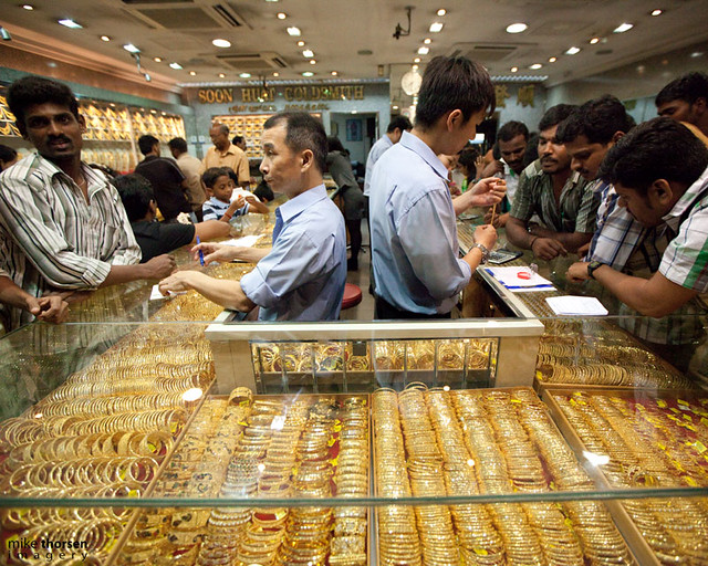 Gold Gold dealers and buyers haggle in a gold shop in Litt… Flickr