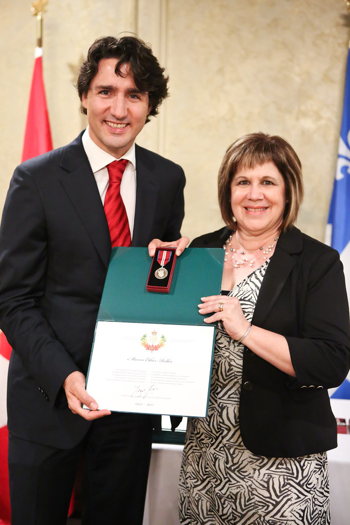 Justin presents Manon EthierRollin with a Queen Elizabeth II Diamond