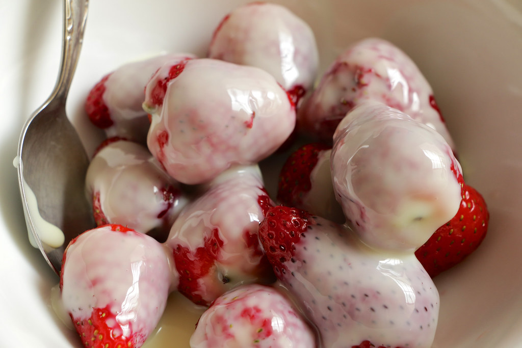 Strawberries Bathed in sweetened condensed milk. Yep, I at… Flickr