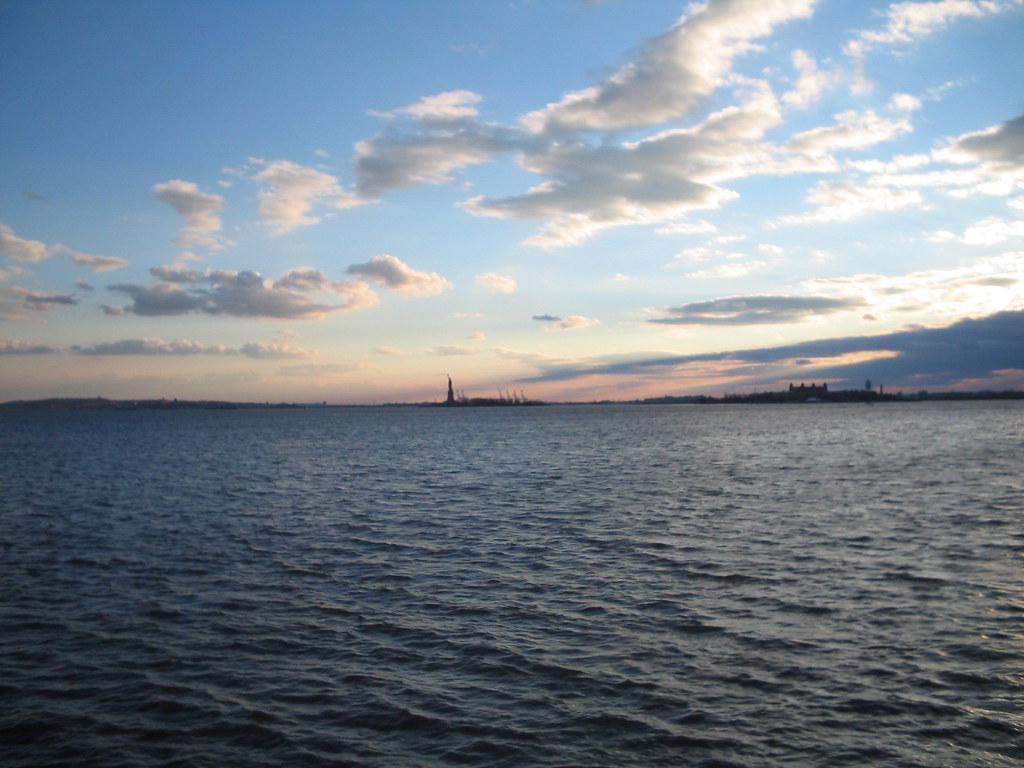 a Statue in the distance Battery Park riverside with b… Flickr