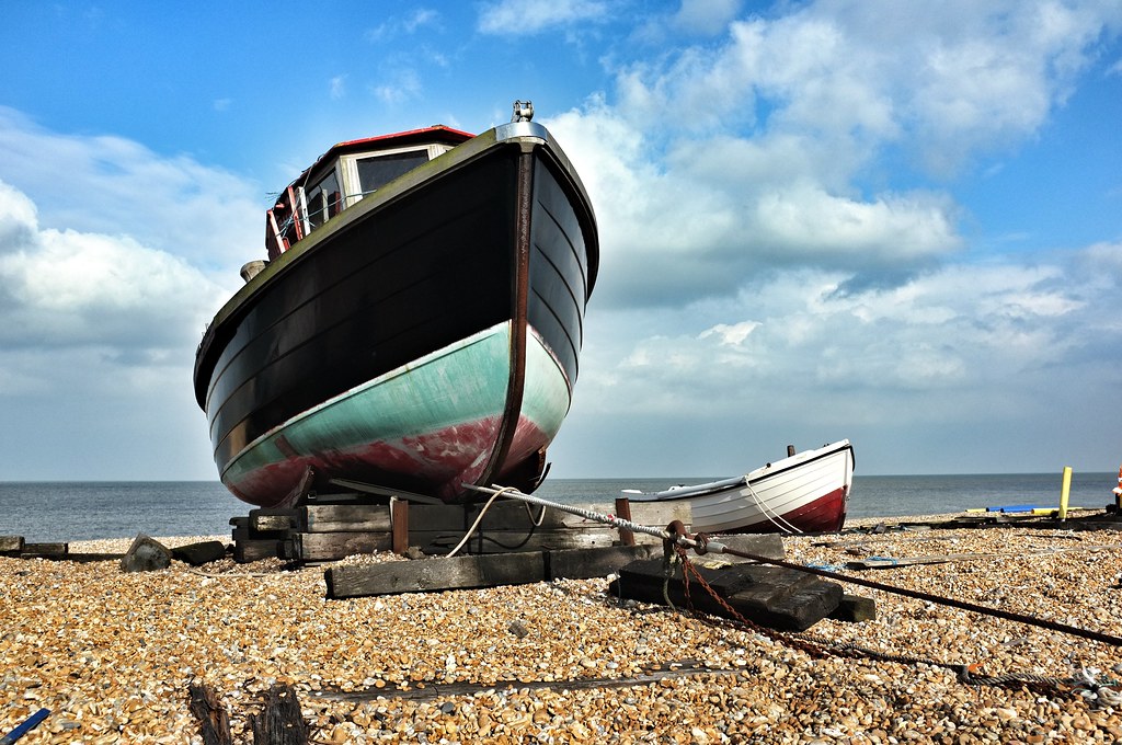 A Boat Beneath a Sunny Sky A BOAT beneath a sunny sky, Lin… Flickr