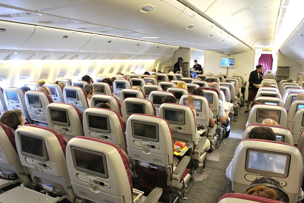 The economy class cabin of a Qatar Airways Boeing 777300ER plane a