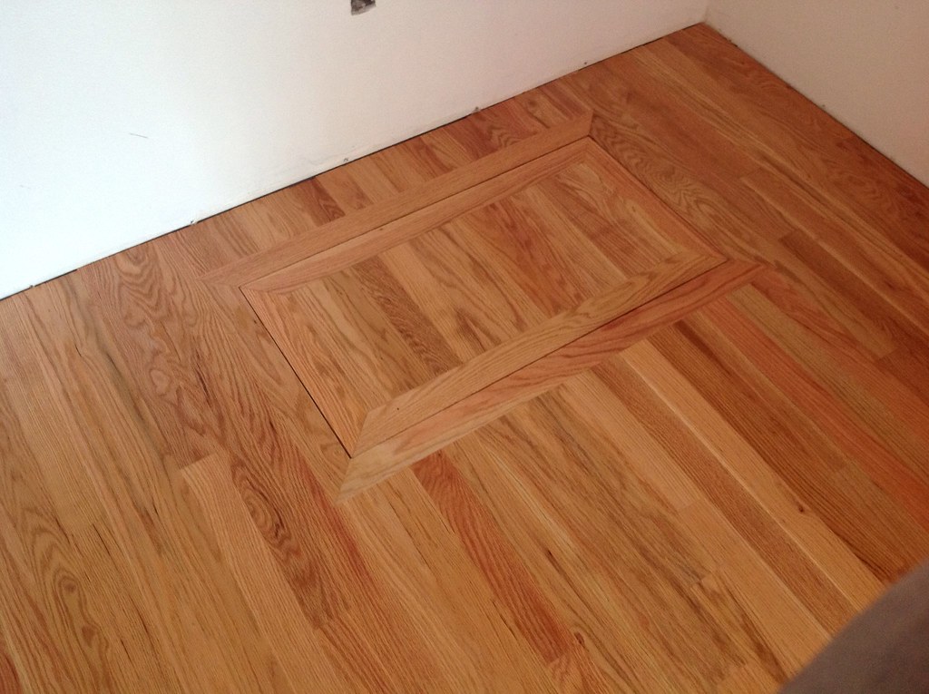 Hardwood floors inside closet. Crawl space access. Flickr