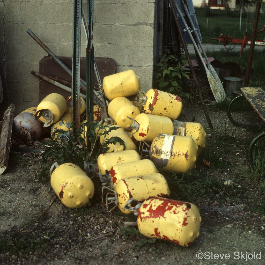 Yellow Gas Tanks. Pile of yellow discarded gas tanks. Buff… Flickr