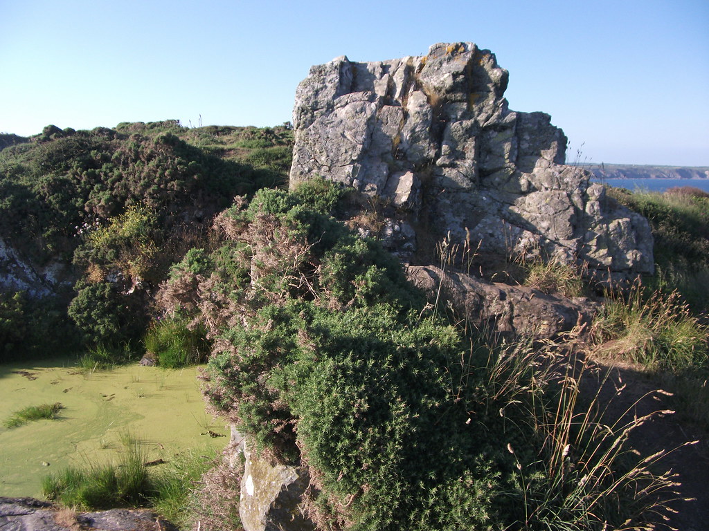 Carn Barrow and flooded serpentine quarry Lizard Peninsula… Flickr