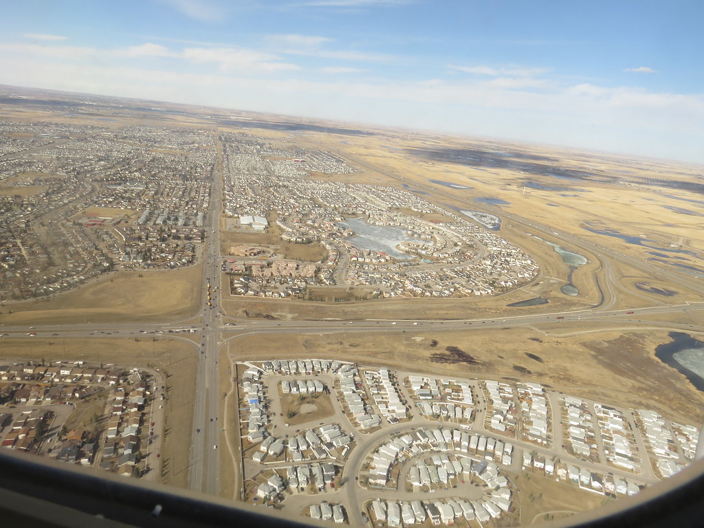 IMG_6185 On eastbound Westjet plane flying over Calgary Andy