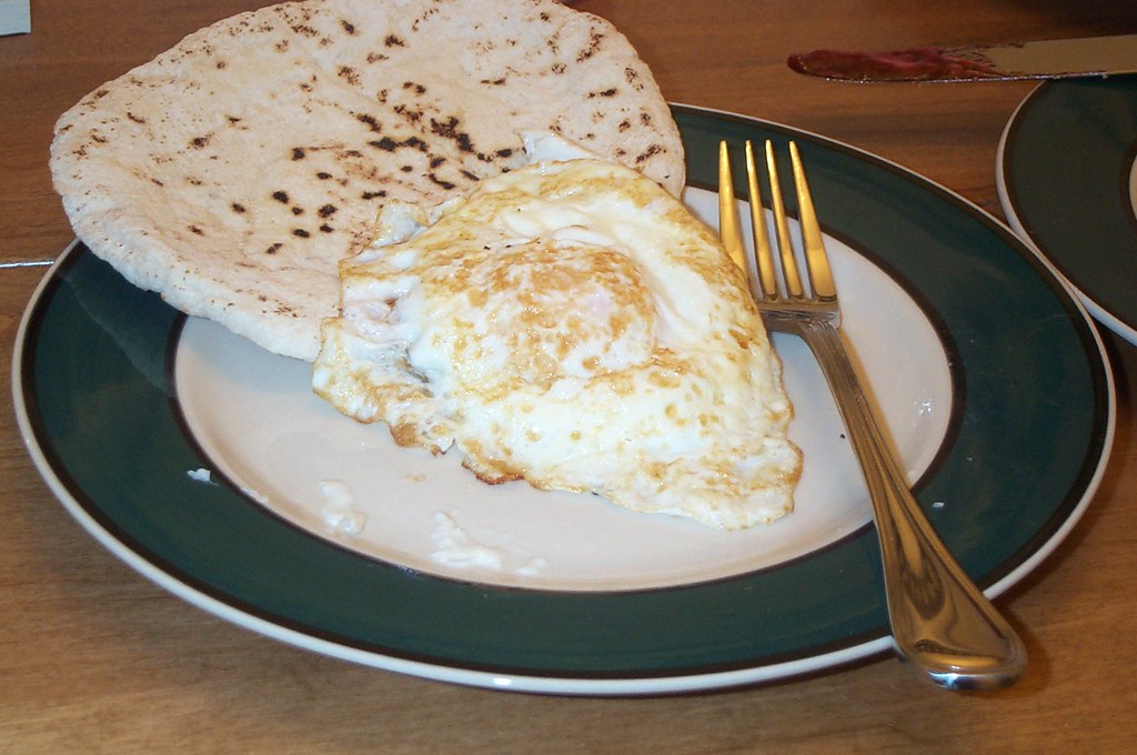 fried egg with pita bread The pita was especially good thi… Flickr