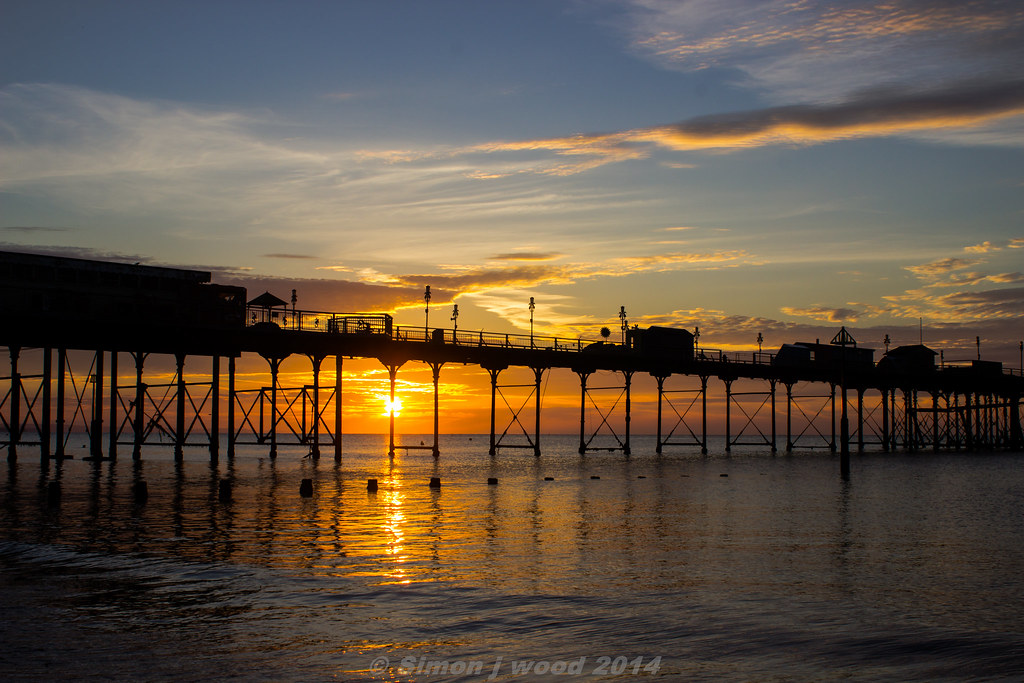 Sunrise sun rising through teignmouth pier in devon Simon Wood Flickr
