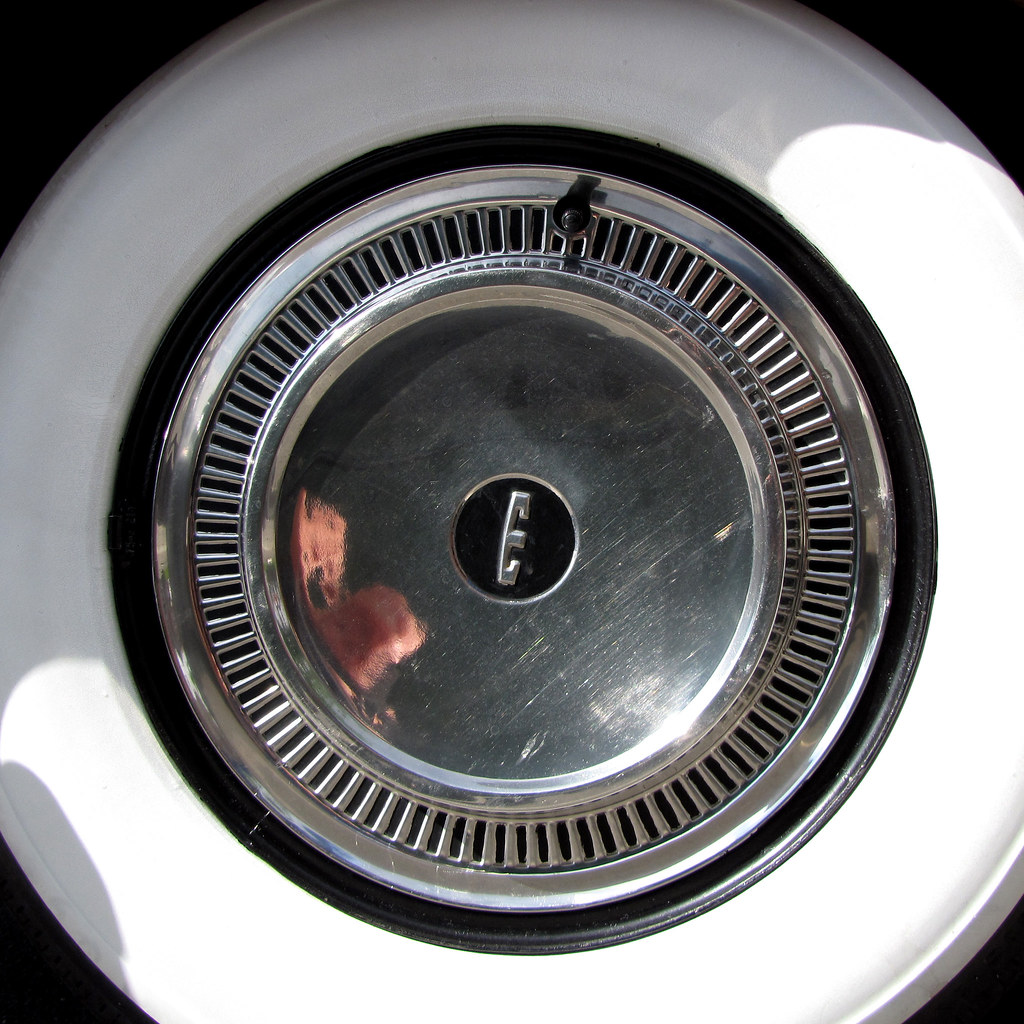 Edsel Hubcap The wheel and hubcap of a 1959 Ford Edsel. (1… Drew