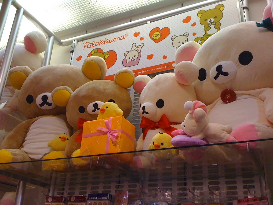 Rilakkuma A few Rilakkuma hiding out on the top shelf. Shibuya246