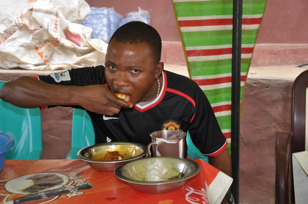 Man eating pounded yam in a canteen Man eating pounded yam… Flickr