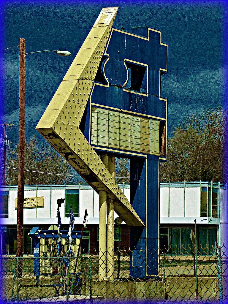 Stripped sign for Boyle's Joyland, Topeka Huge yellow arro… Flickr