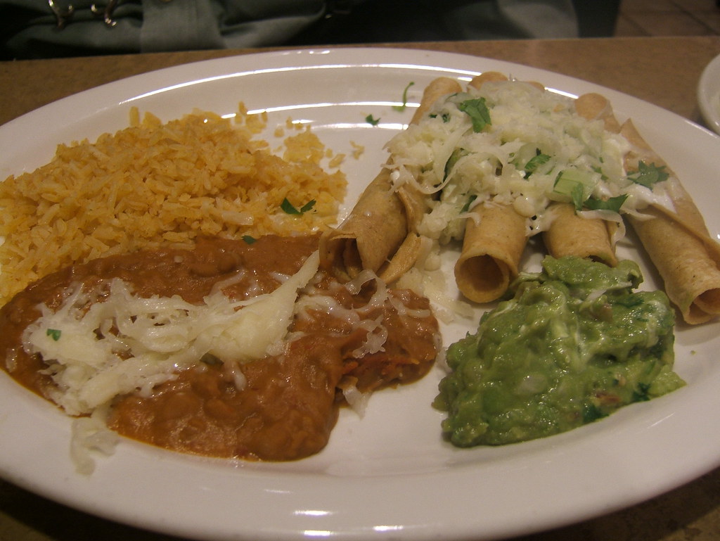 Flautas, Refried Beans, Rice and Guacamole Four flute shap… Flickr