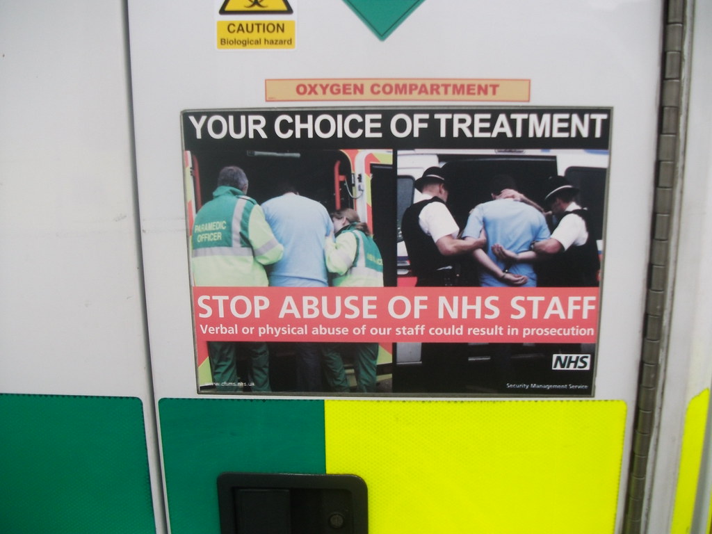 Your Choice of treatment NHS stop abuse of NHS staff poster on RX56DNF