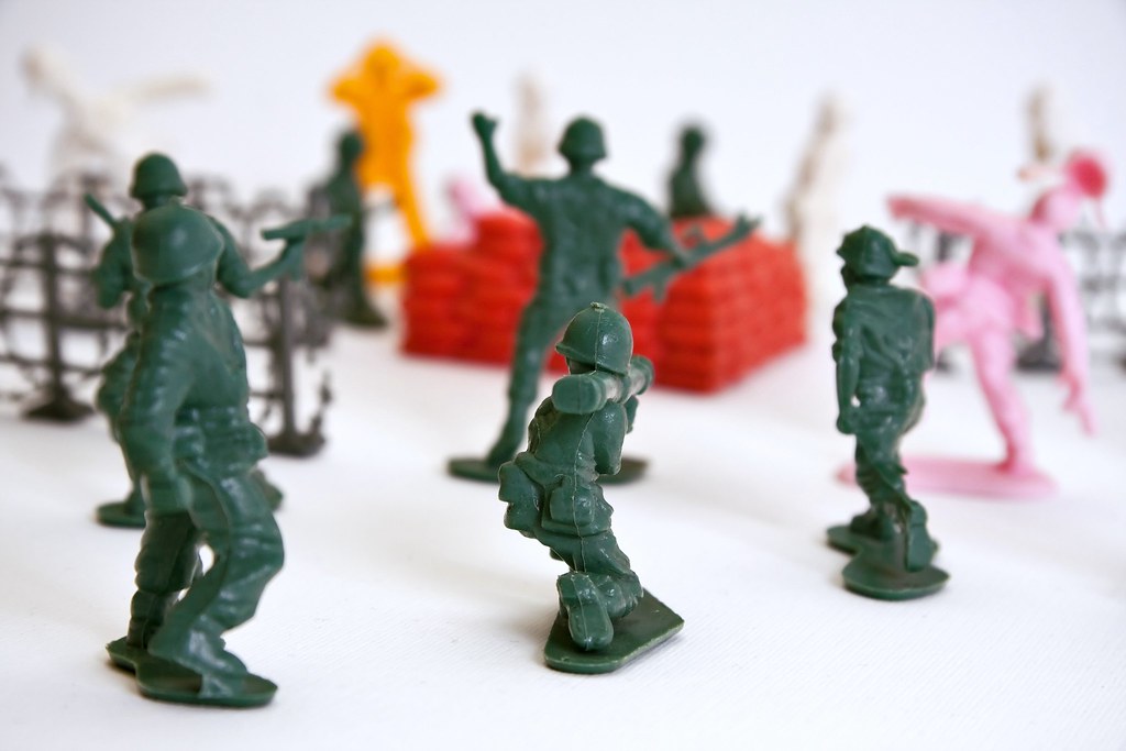 Closeup of toy infantry soldiers recreating a battle scen… Flickr