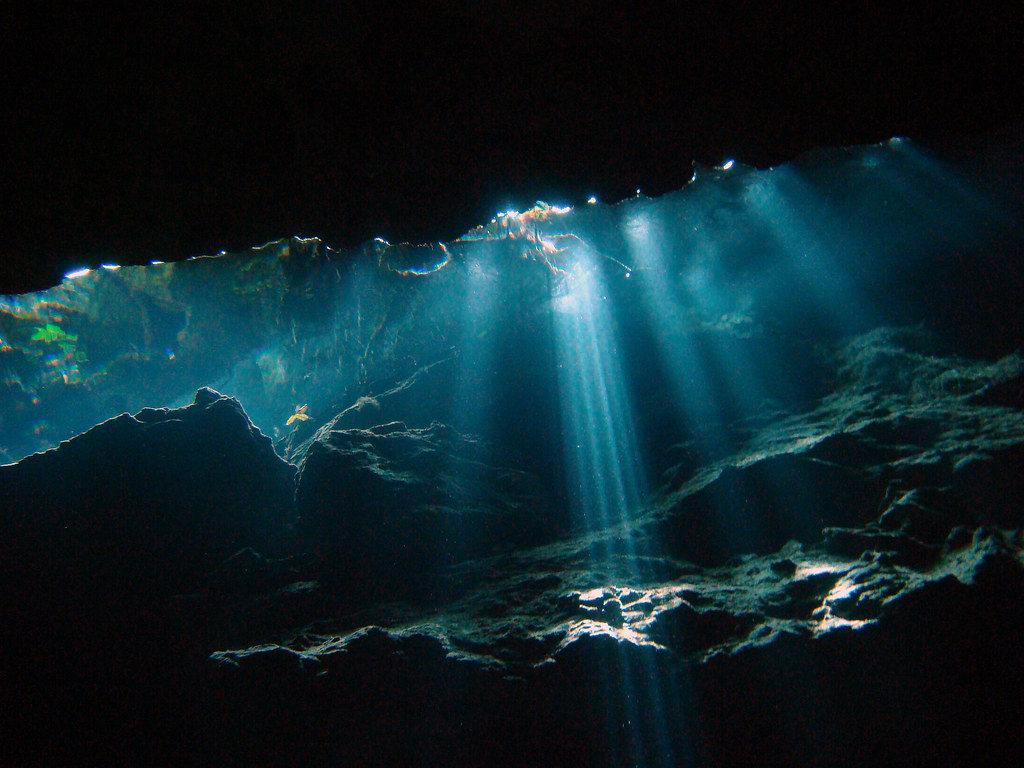 Sunrays shining through the water in ChacMool Cenote Flickr