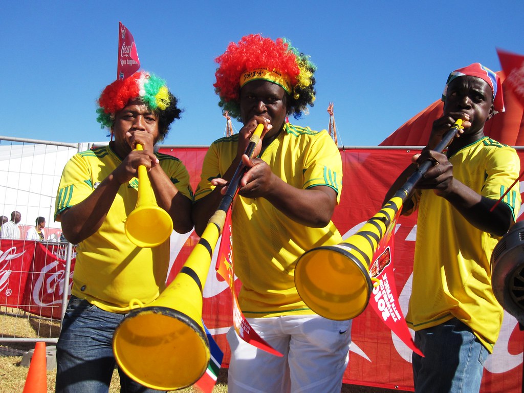 Rainbow blowers Three fans and their vuvuzelas in Nelsprui… Coca