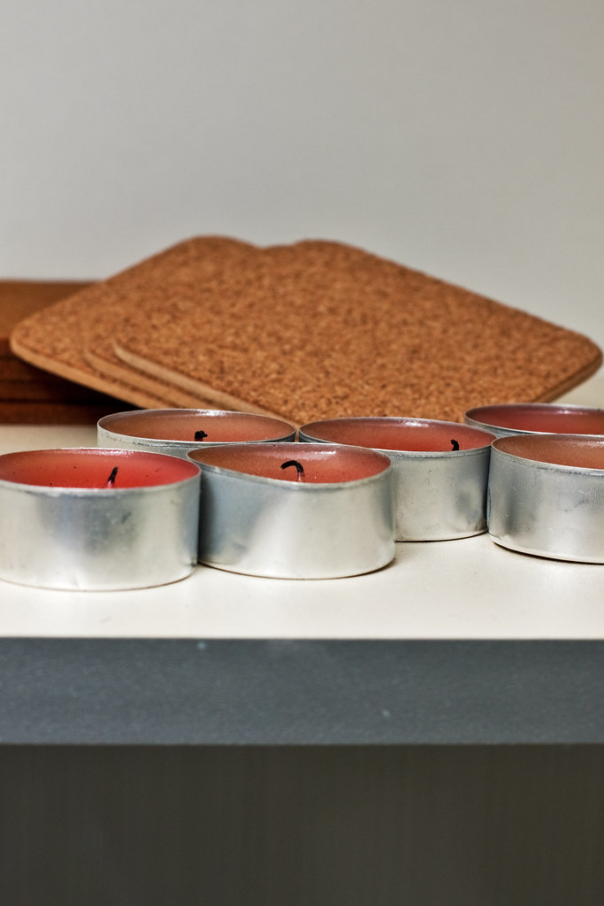 Red burnt candles in aluminum foil on shelf a photo on Flickriver