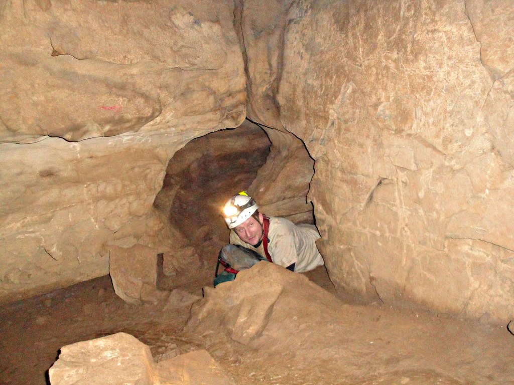 Tight Crawl Chris emerging from a crawl in Rusty's Cave, R… Flickr