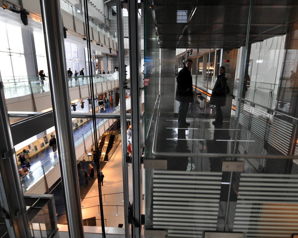 Passing Glass The glass elevator at the Newseum, a journal… Flickr