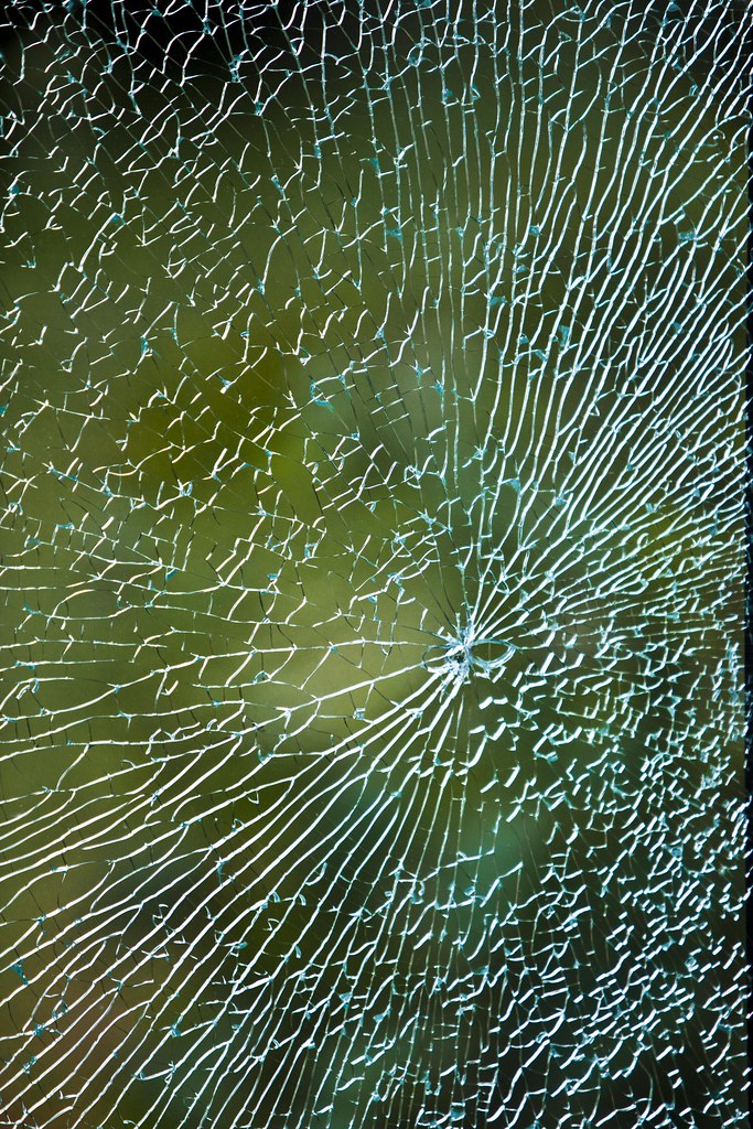 Shattered Broken glass in a sheet of double glazing. Appar… Flickr