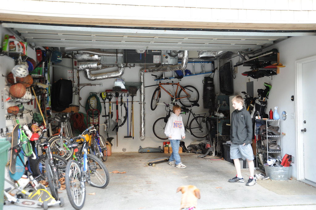 Well organized garage with bikes and tools, basket balls, soccer balls