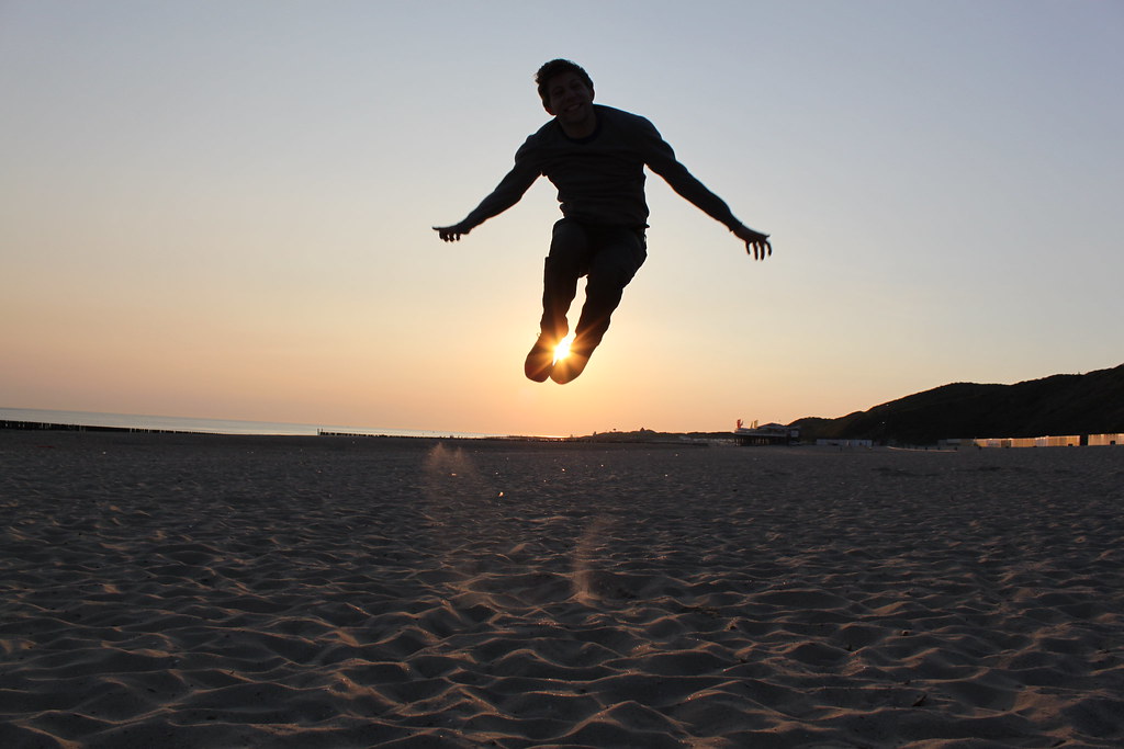 Between my feet // Jumping silly in front of the sun Flickr