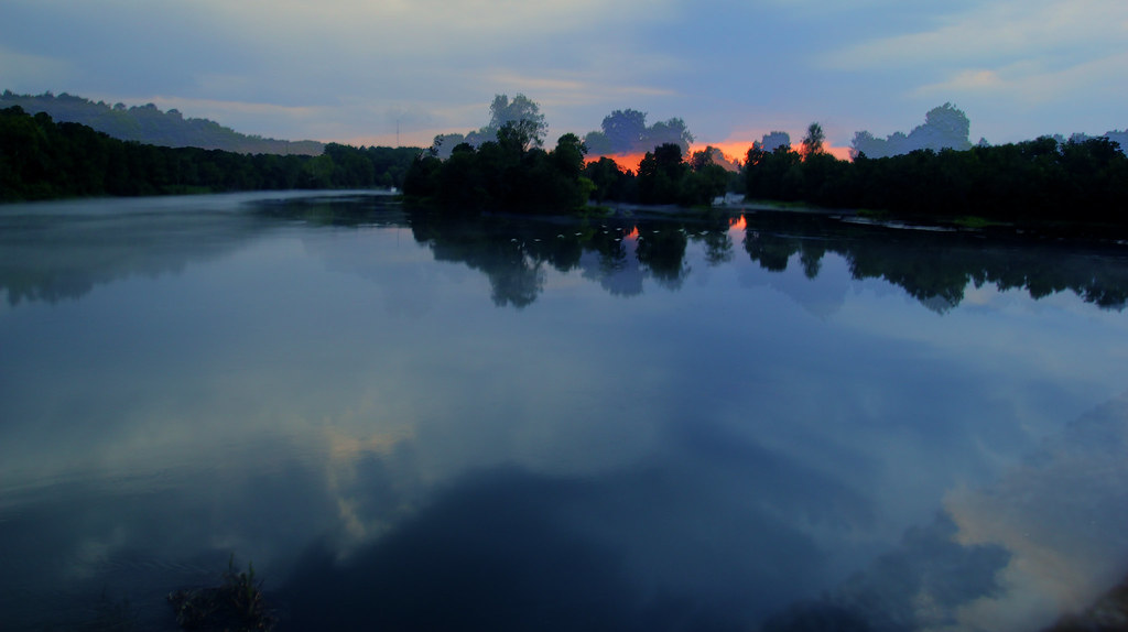 Sunset Augusta, GA Mist on the water and a red sunset. I… Flickr