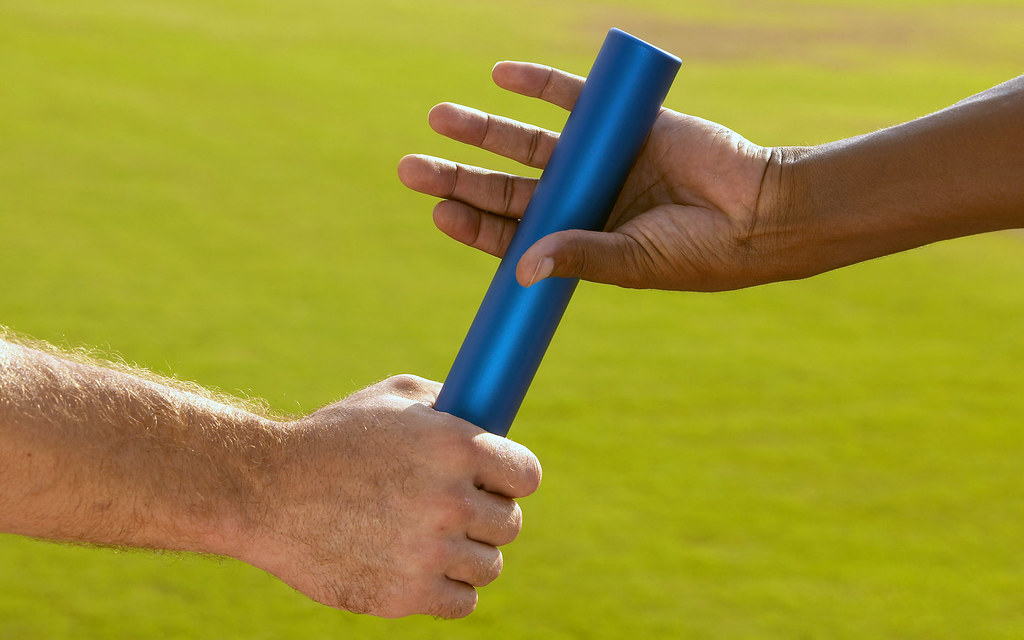 BXP135677 Hands Passing Baton at Sporting Event tableatny Flickr
