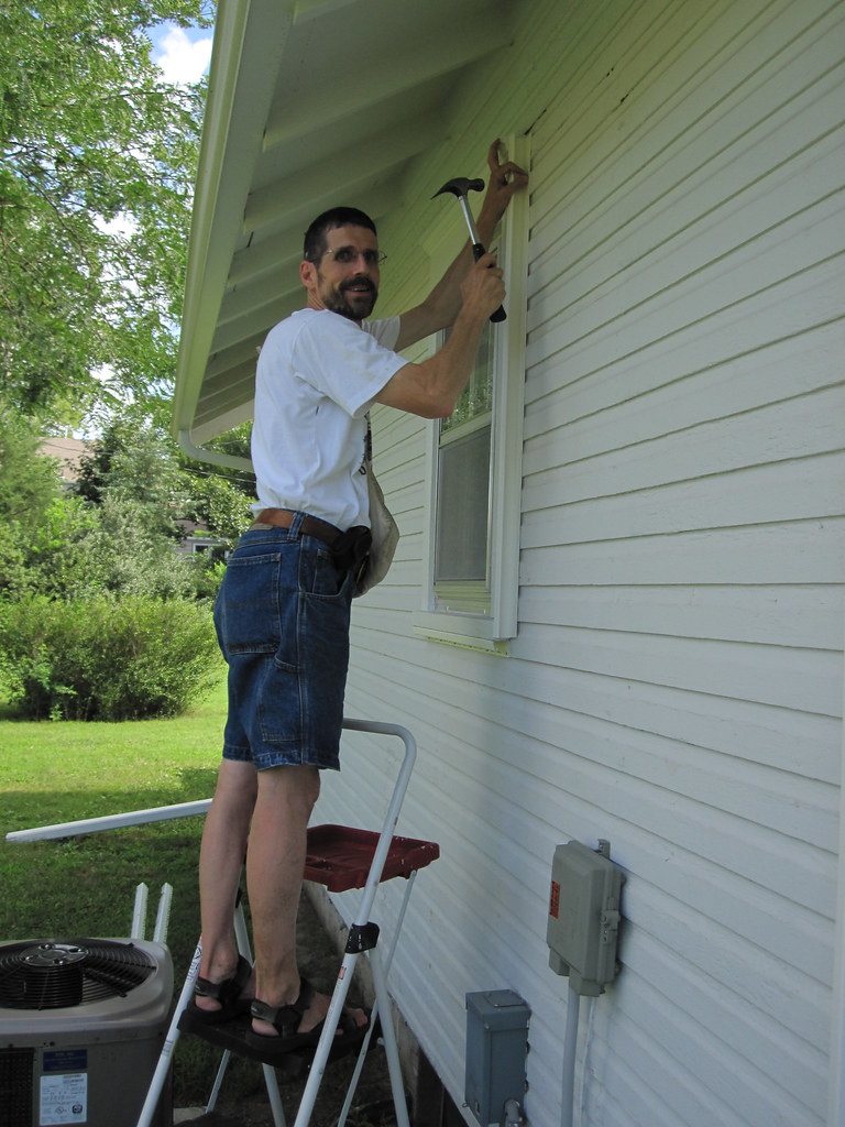 nail by nail Jean stopped painting under the eaves to take… Flickr