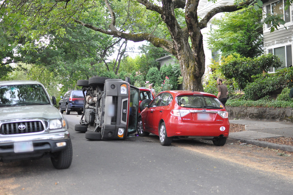 Flipped car at 22nd and Hawthorne Strangest car crash ever… Flickr