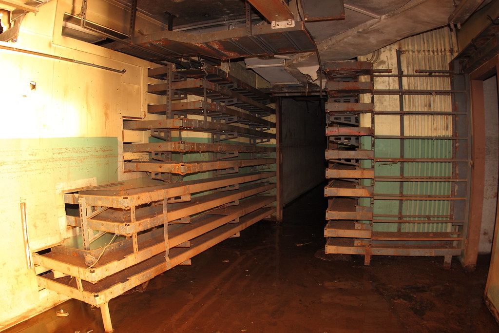 Hall of shelves. Abandoned and flooded building 4 at Syca