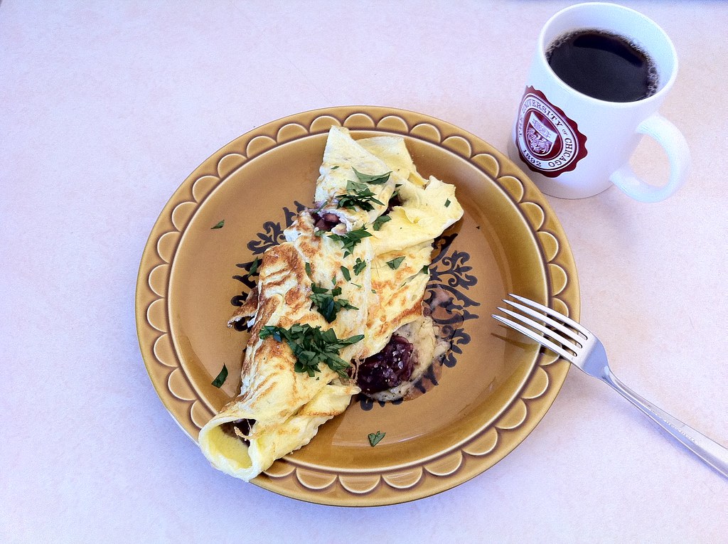 A messy omelet A omelet with mushroom, shallots, and garli… Flickr