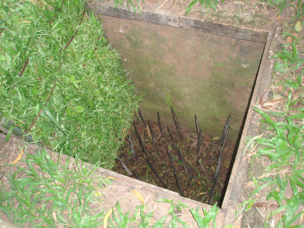 Booby trap at the Cu Chi Tunnels Outside of HCMC. I believ… Flickr
