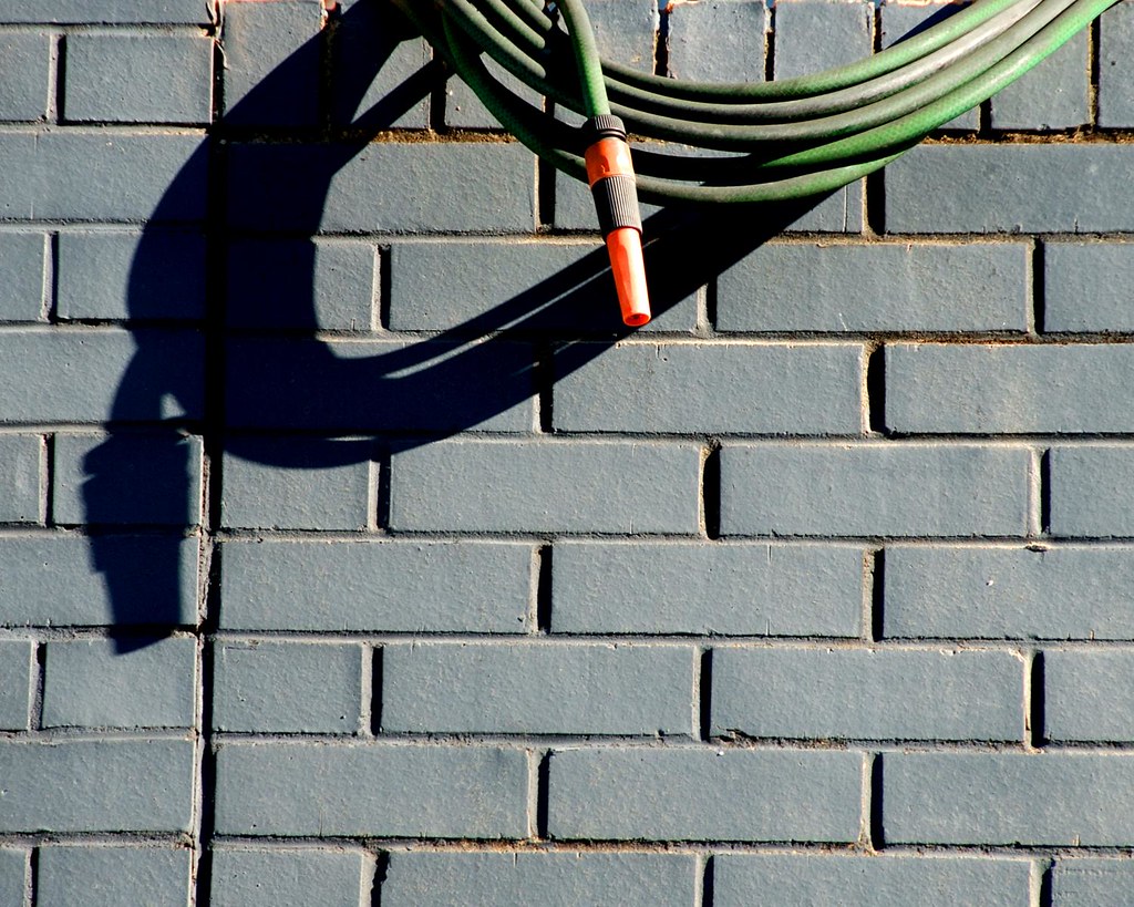 hose the shadow of a hose.......its almost bigger than the… Flickr