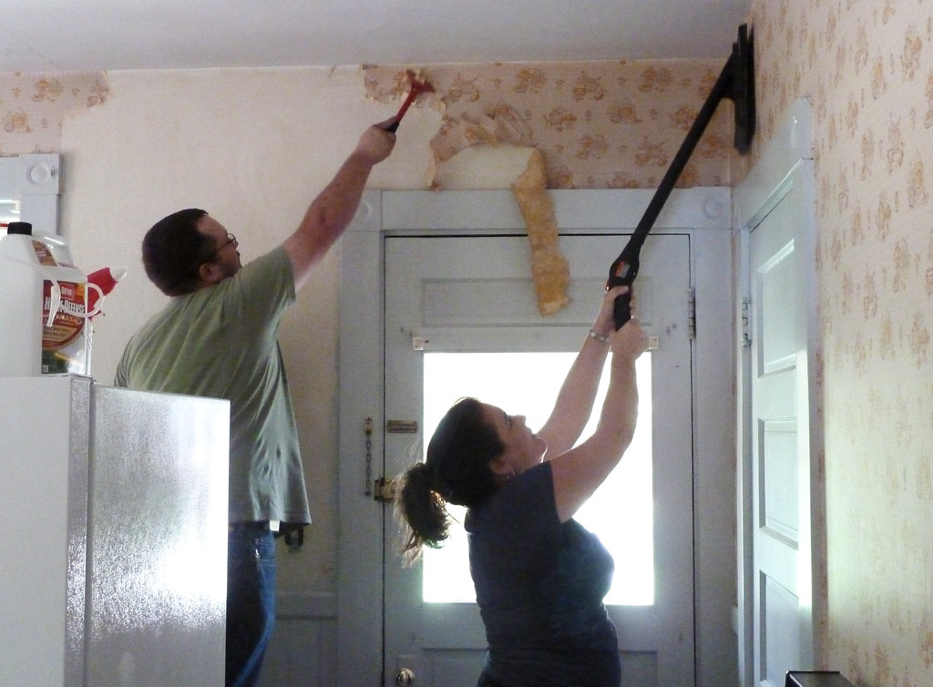 Teamwork Stripping wallpaper off of old hair plaster walls… Flickr