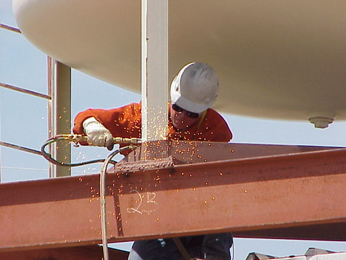 Welding sparks The welder is cutting the supports of a wat… Flickr