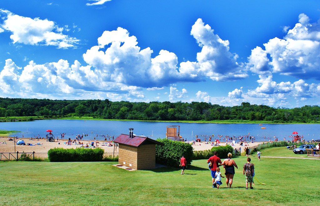 Midwest Beach Fluffy clouds over the beach at Olson Lake i… Flickr