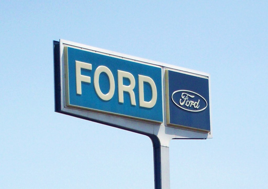 Old Ford Sign Closeup of an old Ford dealership roadside … John