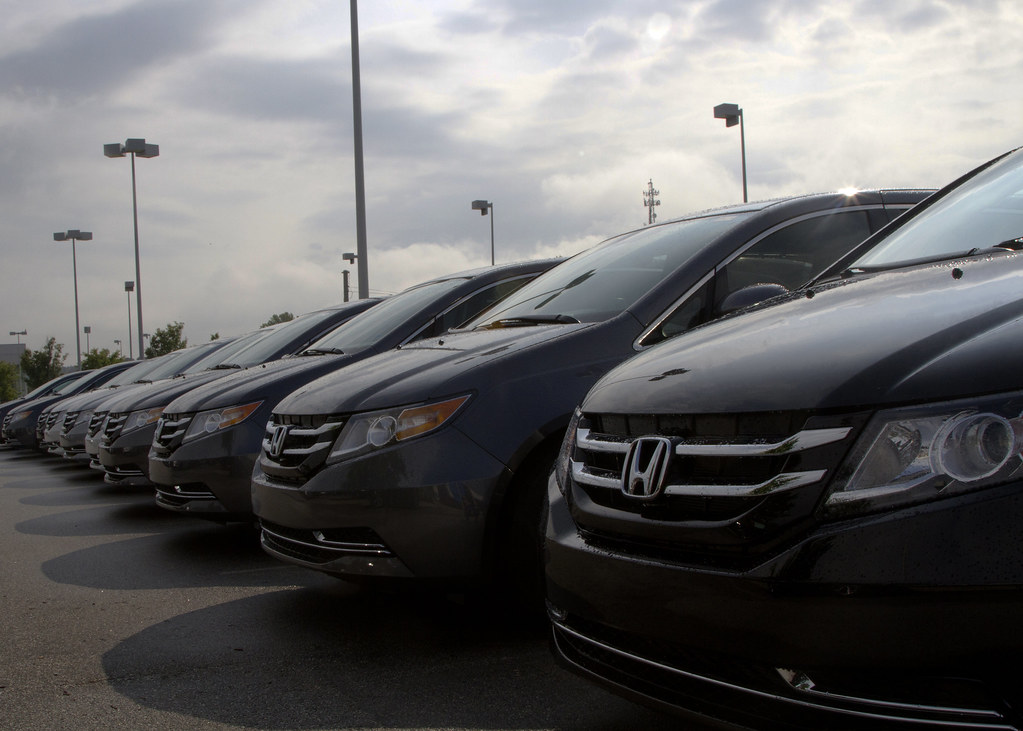 a row of new cars at a Honda car dealership A photograph o… Flickr