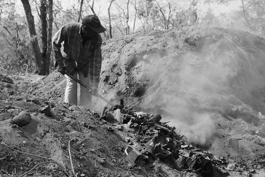 Charcoal production in Nyimba, Zambia A man pull out a pie… Flickr